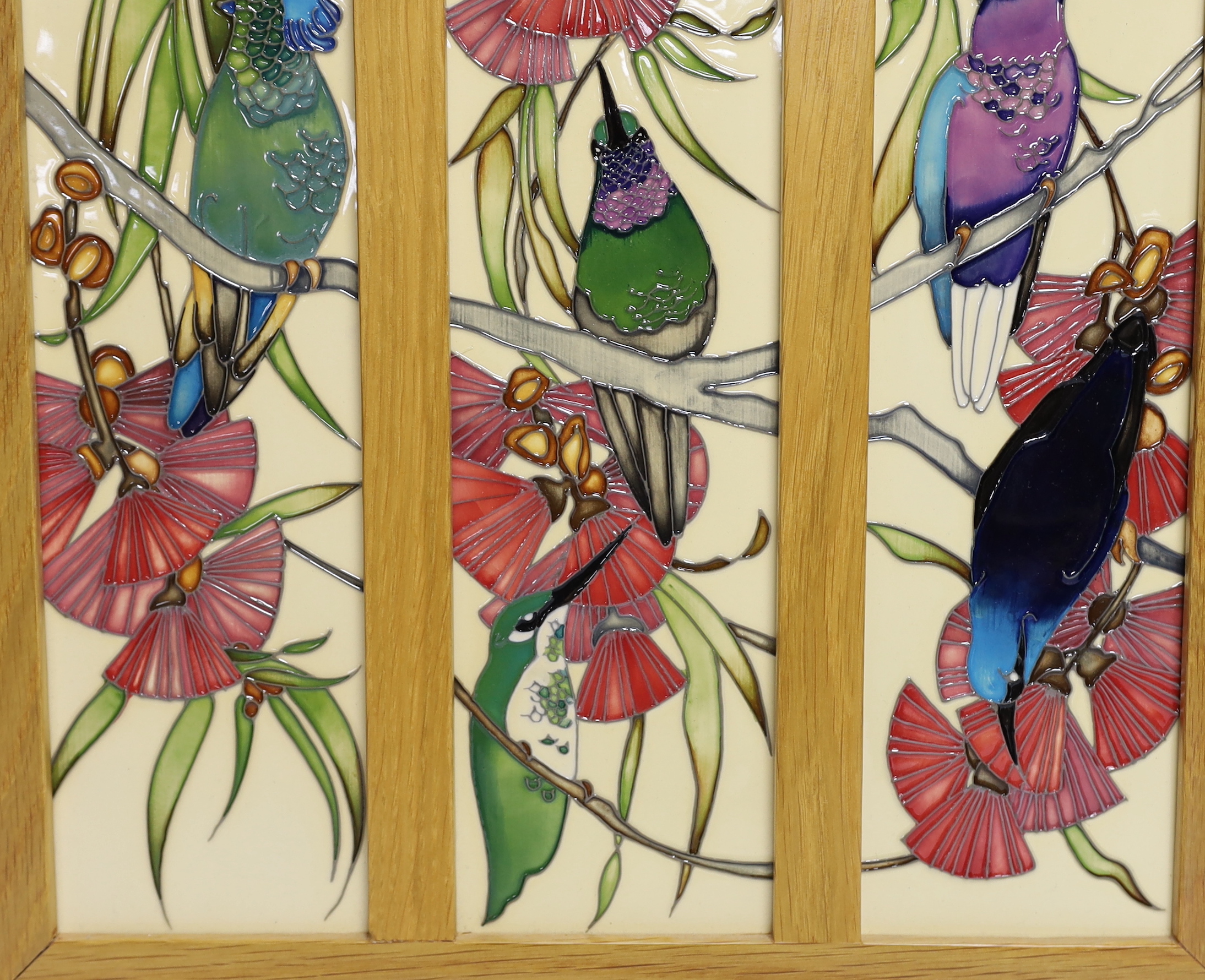 A framed Moorcroft Rachel Bishop triple wall plaque of humming birds, 36 x 38cm total